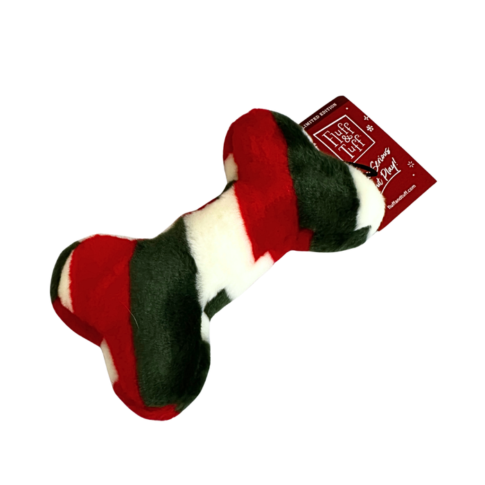 A plush dog toy shaped like a bone. The fabric is patterned with broad alternating white, red, and green stripes.