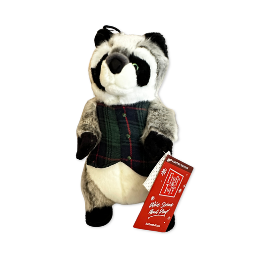 Plush dog toy shaped like a raccoon. It's standing upright on its hind legs and made with plush grey fabric with a white underbelly, black paws and ears, and black and white face. It has green eyes stitched in with green and black thread. It's wearing a false-fronted vest with a green and navy blue check and a read stripe.