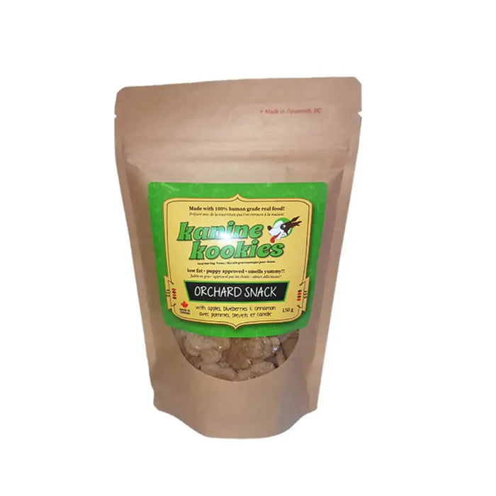 Brown craft resealable bag of dog cookies with a green and yellow label and a clear window showing brown cookies.