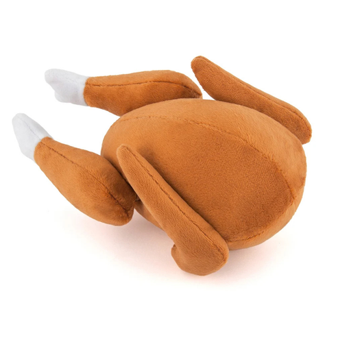 Plush dog toy shaped like a roast turkey. It's mainly made with brown plush fabric, with white fabric at the end of the drumsticks to indicate the end of bones.