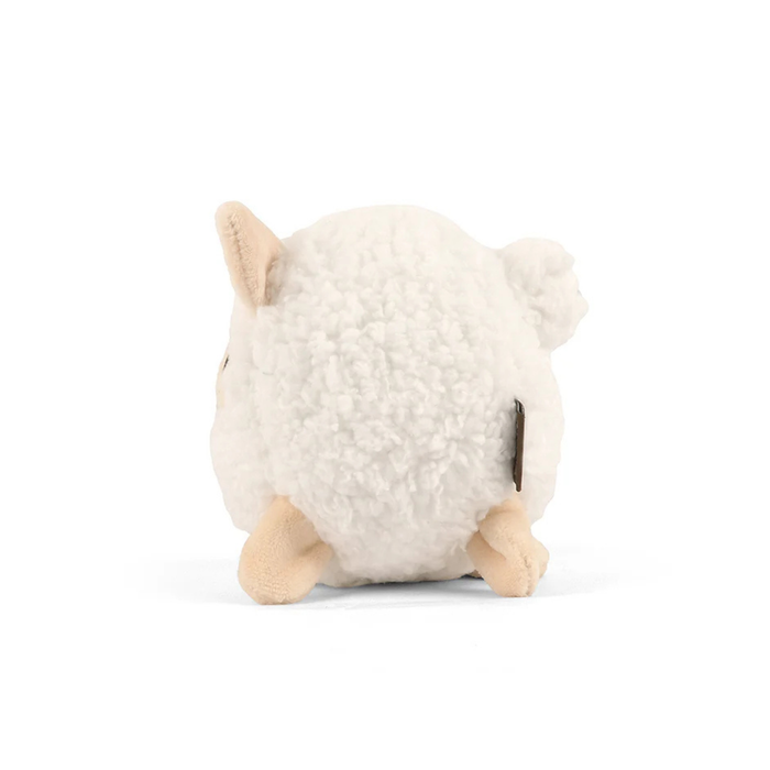 Side view of a dog toy shaped like a round woolly sheep. It has a white fleece and beige ears and legs, as well as a round white fleece tail.