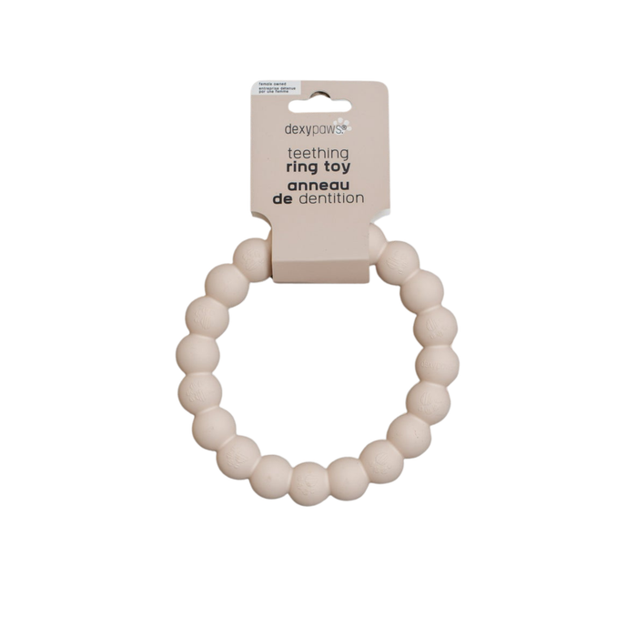 A nude-coloured dog toy made up of smaller fused spheres to create a larger ring.